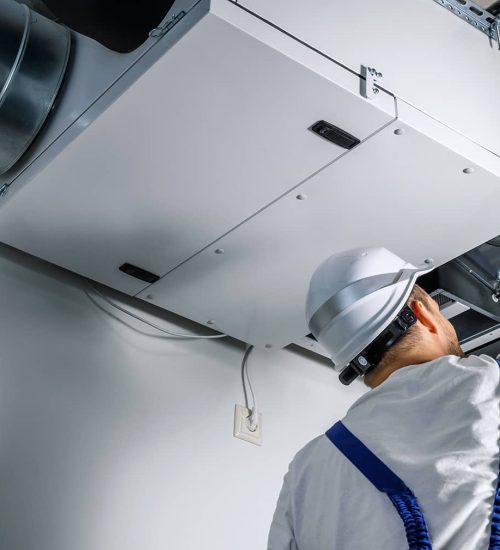 C1-Featured-Image-HVAC-Tech-inspecting-a-unit_